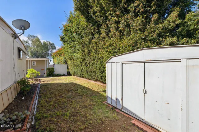 a view of a backyard with jacuzzi
