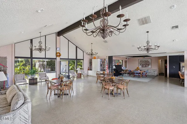 a view of a dining room with furniture window and outside view