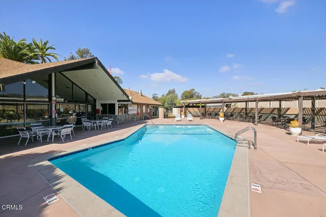 a view of a swimming pool with a lounge chair