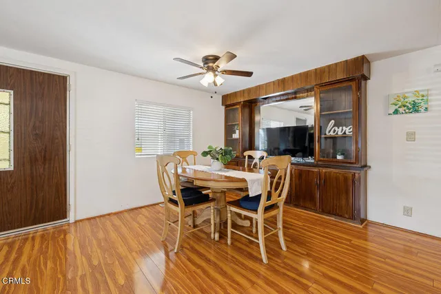 a dining room with furniture and window