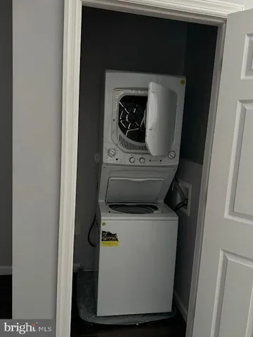 a view of a patio with table and chairs potted plants
