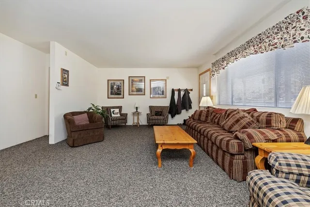 a bedroom with bed and a couch