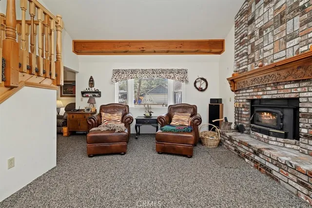 a view of a livingroom with furniture and stairs