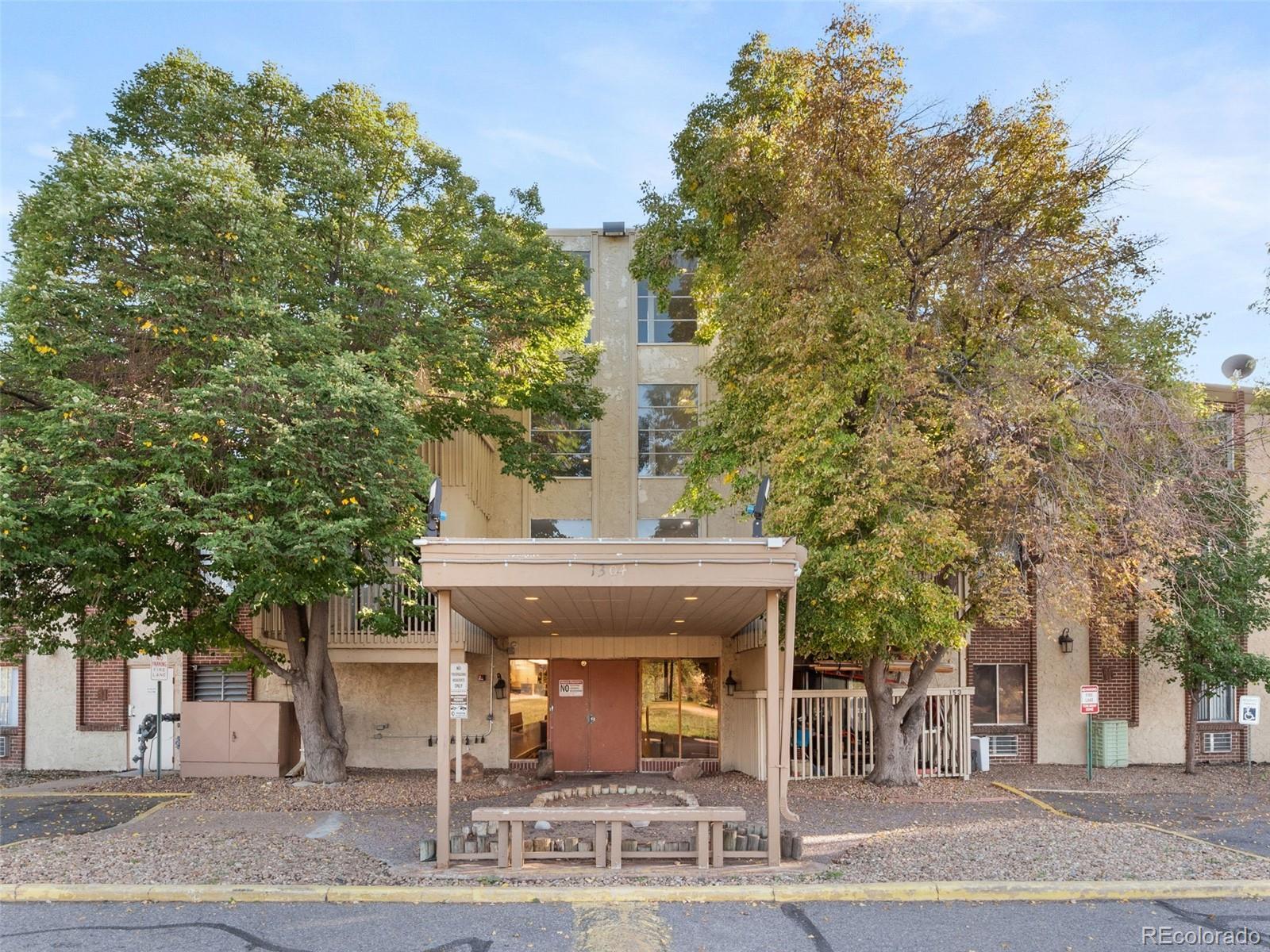 a view of a building with trees
