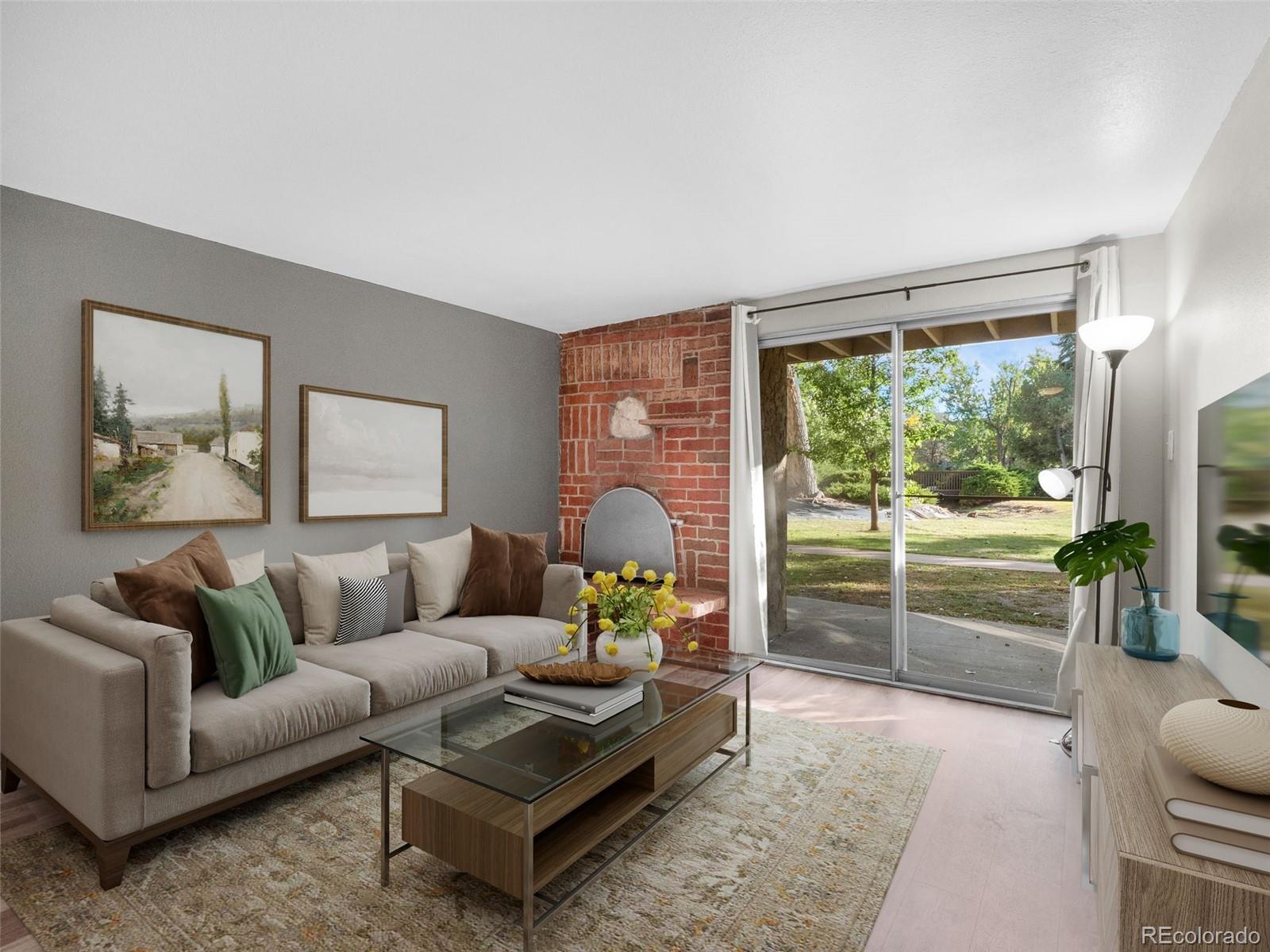 1304 South Parker Road, Unit 146 Denver, CO 80231 - Photo 5 of 22 a living room with furniture and a large window