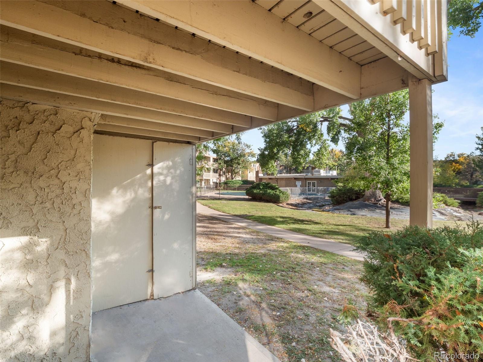 1304 South Parker Road, Unit 146 Denver, CO 80231 - Photo 10 of 22 a view of a porch with garden