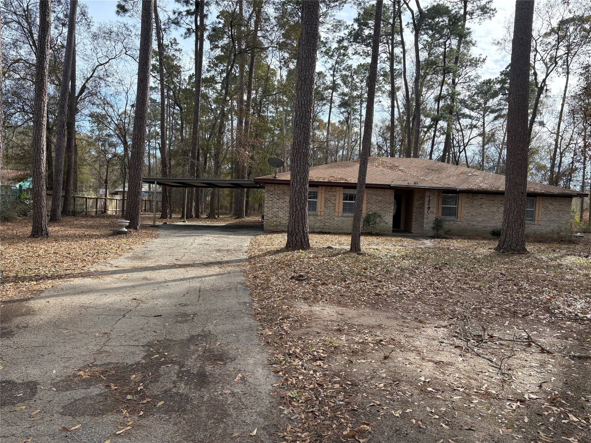 13160 Crystal Trail Conroe, TX 77306 - Photo 14 of 14 The carport is attached to the garage. Plenty of covered parking for everyone!!