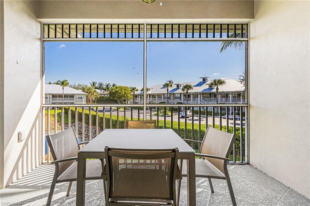 7910 Mahogany Run Lane, Unit 1225 Naples, FL 34113 - Photo 20 of 42 a view of a balcony with furniture