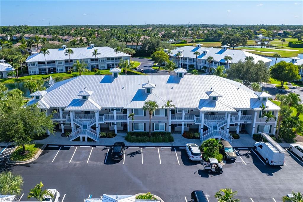 7910 Mahogany Run Lane, Unit 1225 Naples, FL 34113 - Photo 21 of 42 an aerial view of a house with garden space and street view