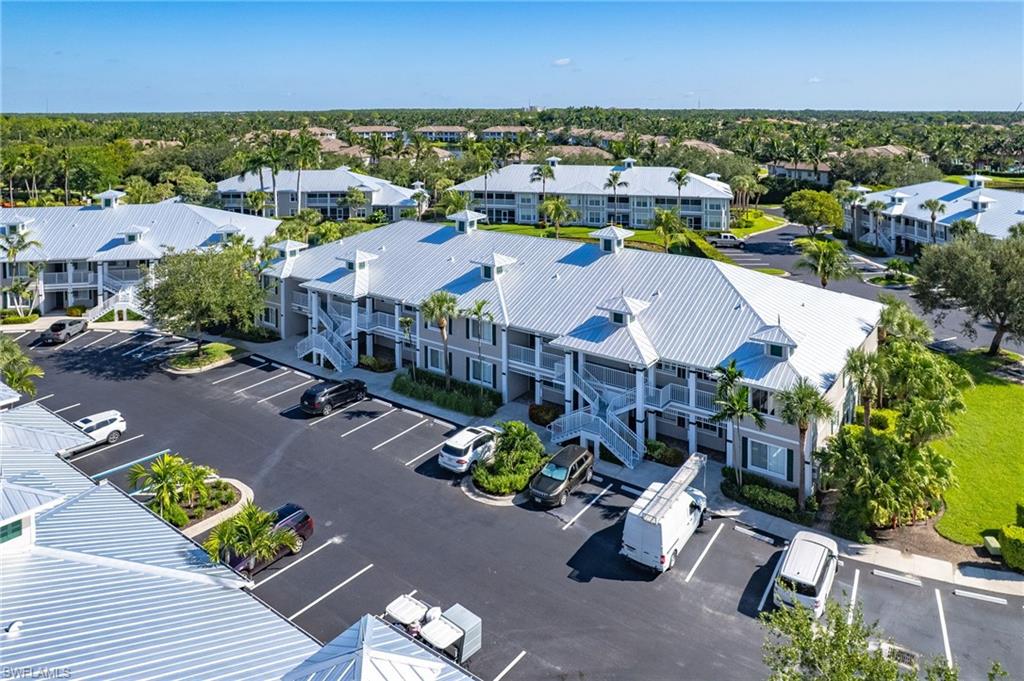7910 Mahogany Run Lane, Unit 1225 Naples, FL 34113 - Photo 25 of 42 an aerial view of a houses with yard