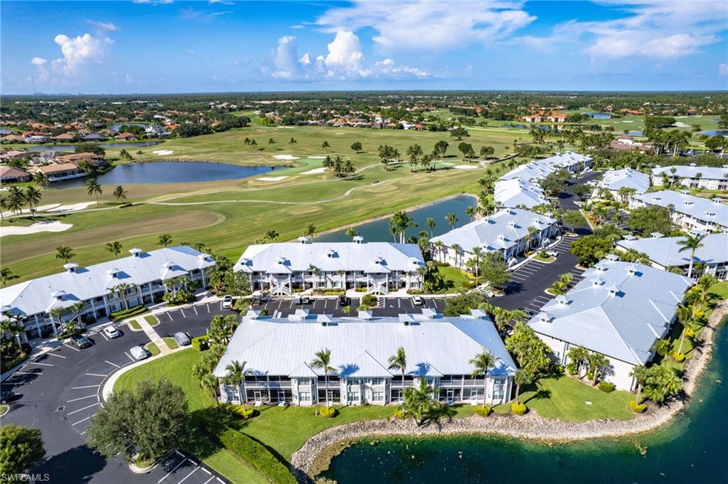 7910 Mahogany Run Lane, Unit 1225 Naples, FL 34113 - Photo 26 of 42 an aerial view of residential houses with outdoor space and ocean view