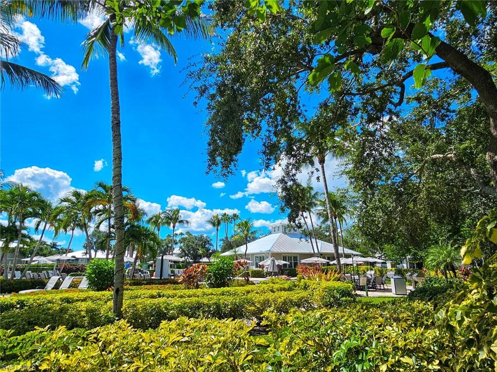 7910 Mahogany Run Lane, Unit 1225 Naples, FL 34113 - Photo 27 of 42 a view of a house with a yard