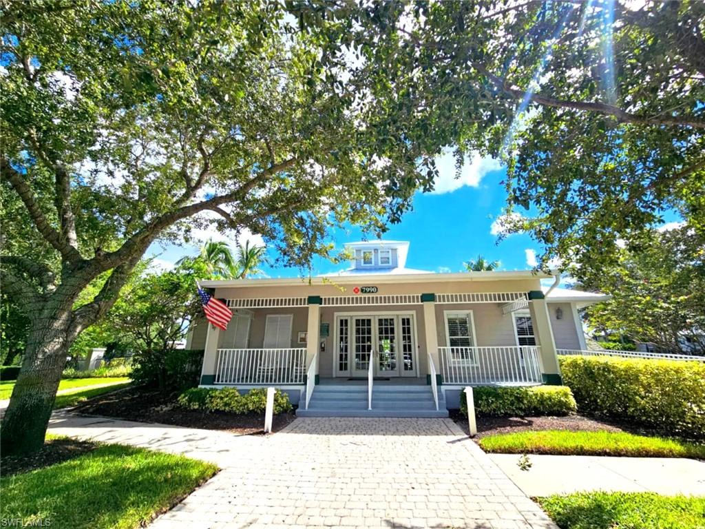 7910 Mahogany Run Lane, Unit 1225 Naples, FL 34113 - Photo 28 of 42 a front view of a house with garden