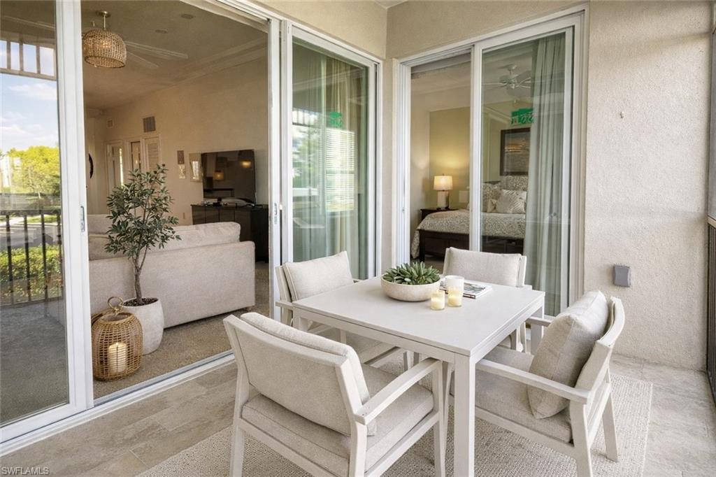 7910 Mahogany Run Lane, Unit 1225 Naples, FL 34113 - Photo 29 of 48 a view of a dining room with furniture and front door