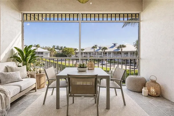a view of a balcony with furniture