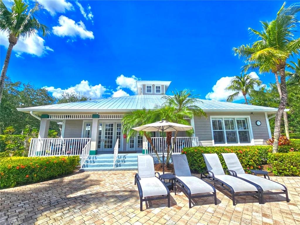 7910 Mahogany Run Lane, Unit 1225 Naples, FL 34113 - Photo 32 of 42 a view of a house with backyard porch and sitting area