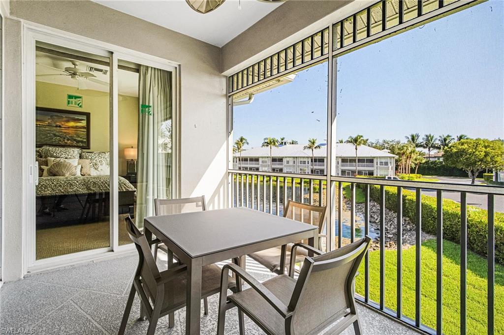 7910 Mahogany Run Lane, Unit 1225 Naples, FL 34113 - Photo 34 of 48 a view of a balcony with furniture