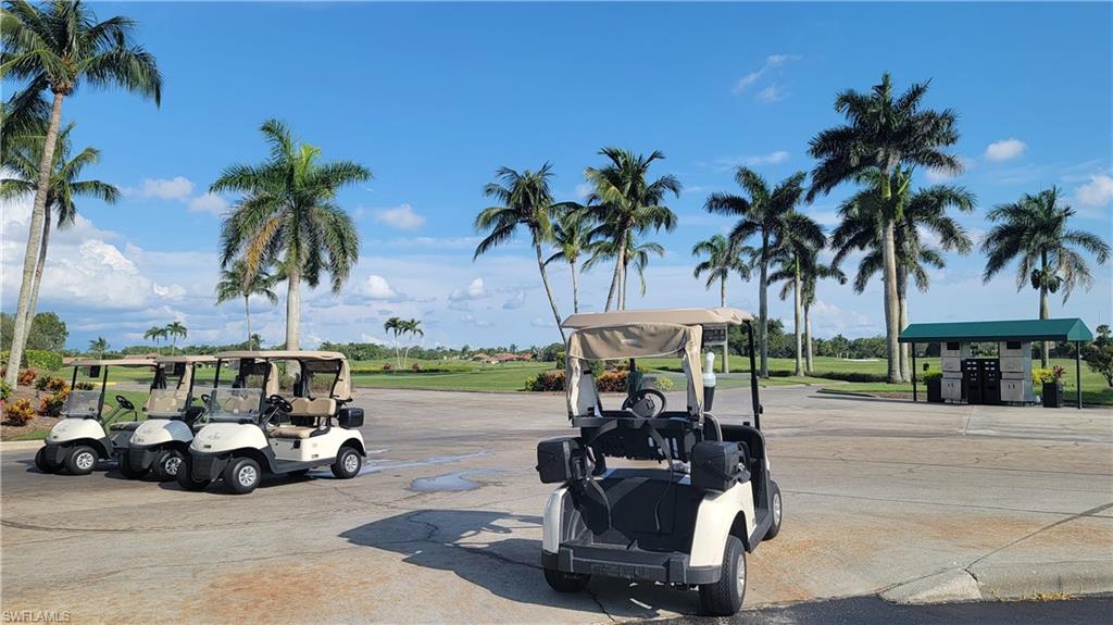 7910 Mahogany Run Lane, Unit 1225 Naples, FL 34113 - Photo 41 of 42 a view of a street with a bike and cars
