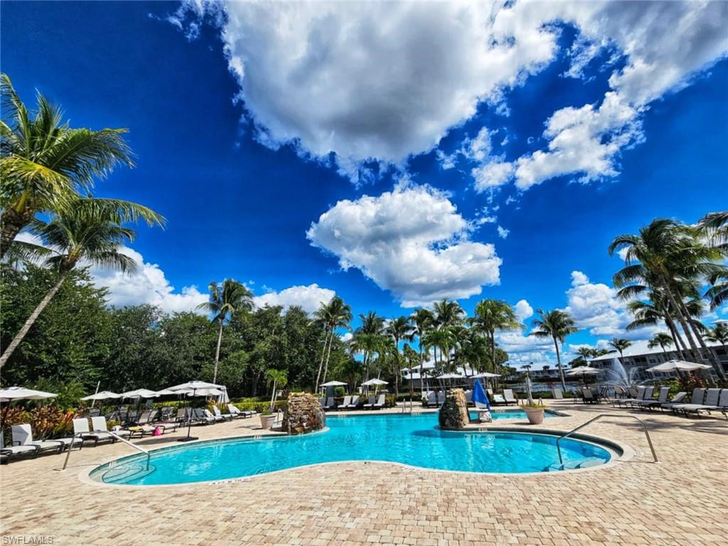 7910 Mahogany Run Lane, Unit 1225 Naples, FL 34113 - Photo 42 of 48 a view of a house with swimming pool and sitting area