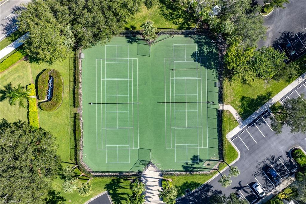 7910 Mahogany Run Lane, Unit 1225 Naples, FL 34113 - Photo 45 of 48 a green field with some trees in the background