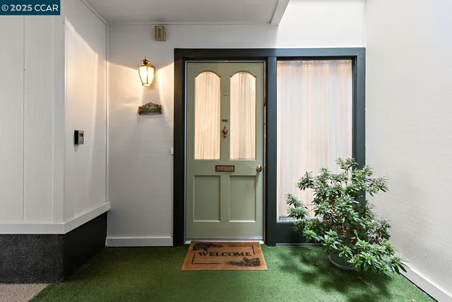 an empty room with potted plants and wooden floor