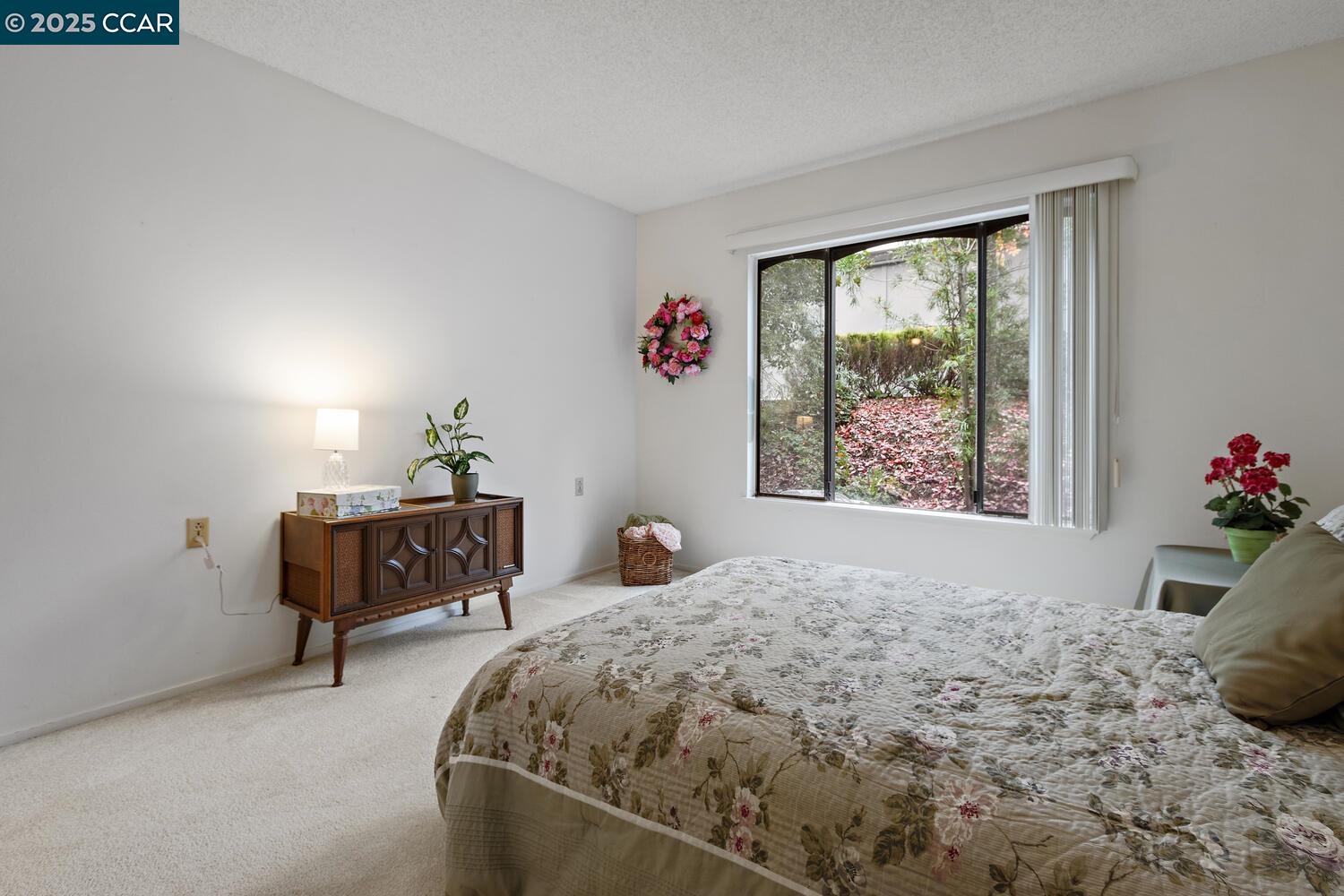 2709 Golden Rain Road, Unit 6 Walnut Creek, CA 94595 - Photo 14 of 46 a bedroom with a bed and a window