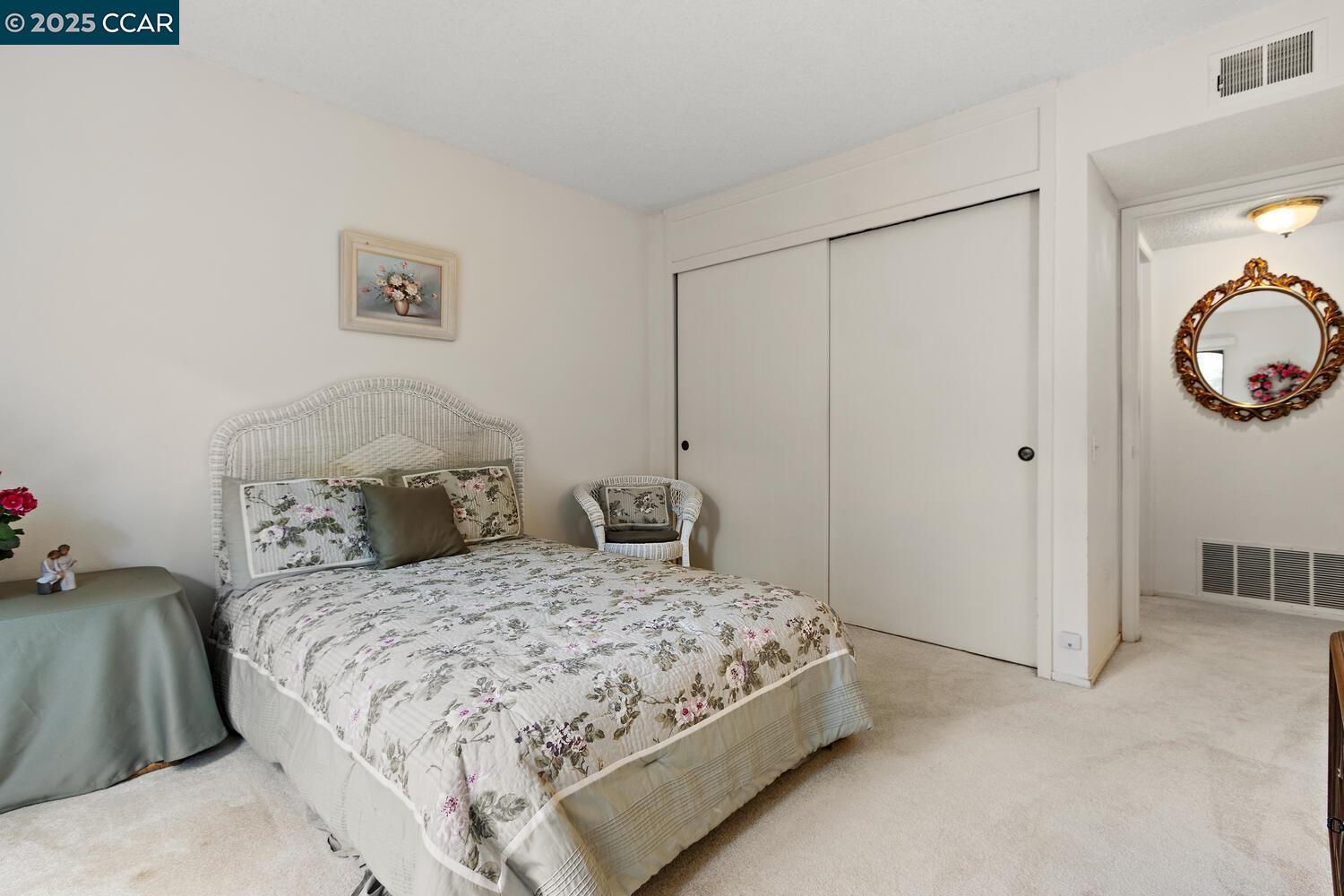 2709 Golden Rain Road, Unit 6 Walnut Creek, CA 94595 - Photo 15 of 46 a bedroom with a bed and a window