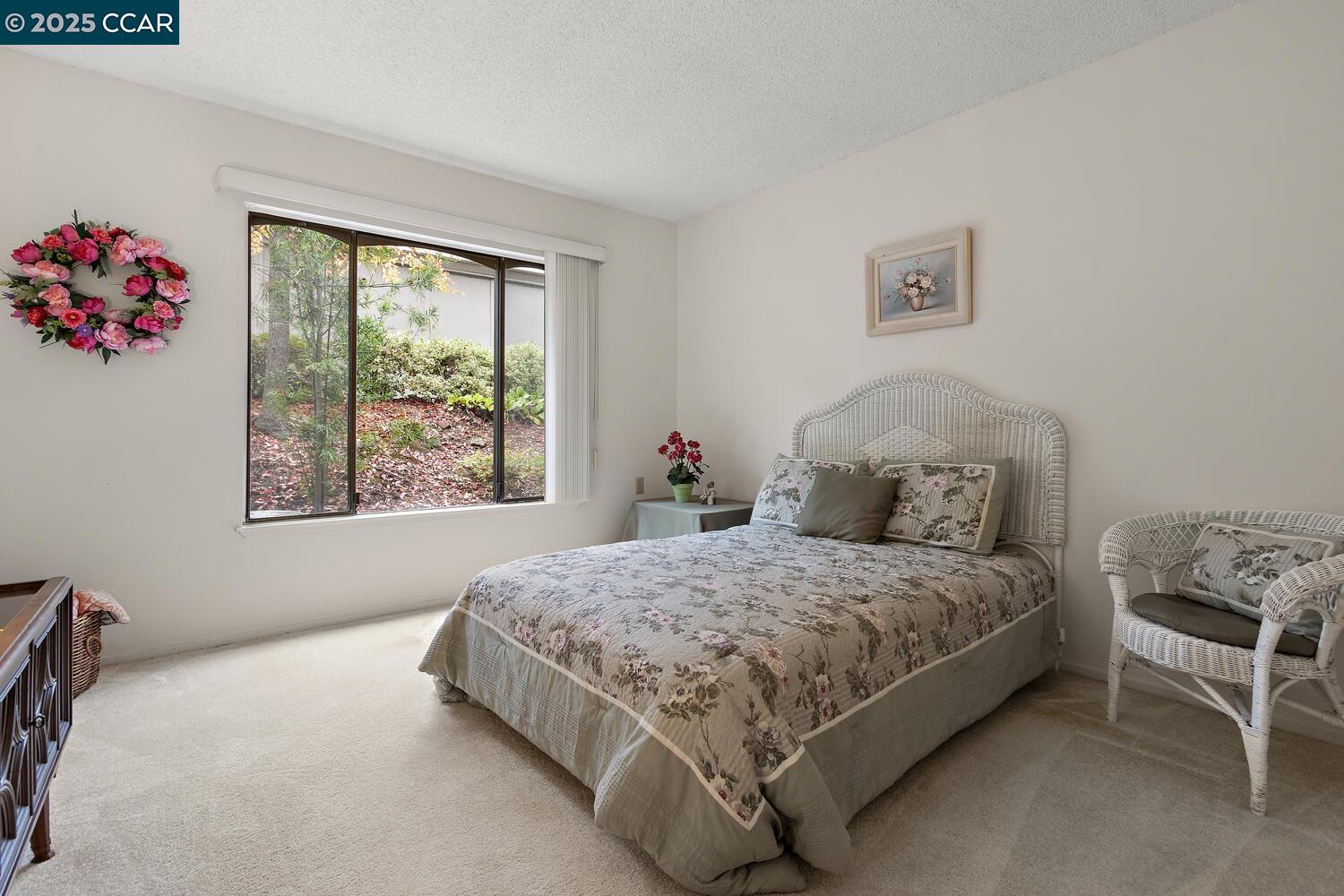 2709 Golden Rain Road, Unit 6 Walnut Creek, CA 94595 - Photo 16 of 46 a bedroom with a bed and a window