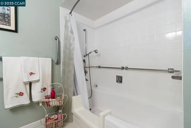 a bathroom with a tub and a shower