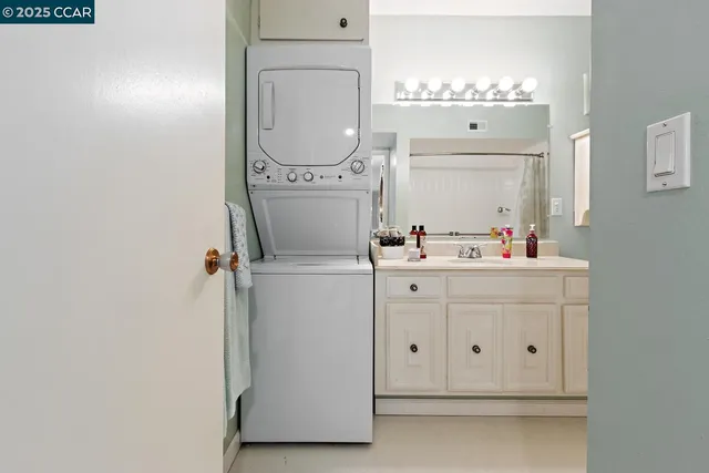a bathroom with a sink vanity and a mirror
