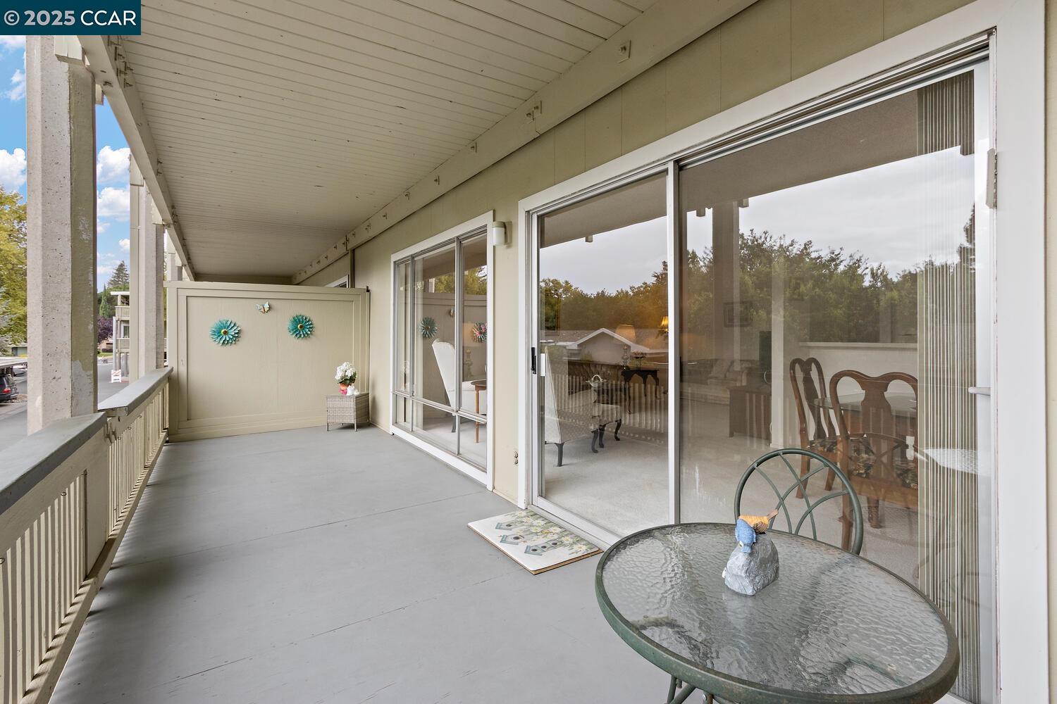 2709 Golden Rain Road, Unit 6 Walnut Creek, CA 94595 - Photo 21 of 46 a view of a livingroom with furniture and floor to ceiling window