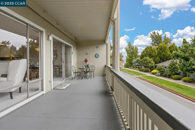 a view of a porch and garden