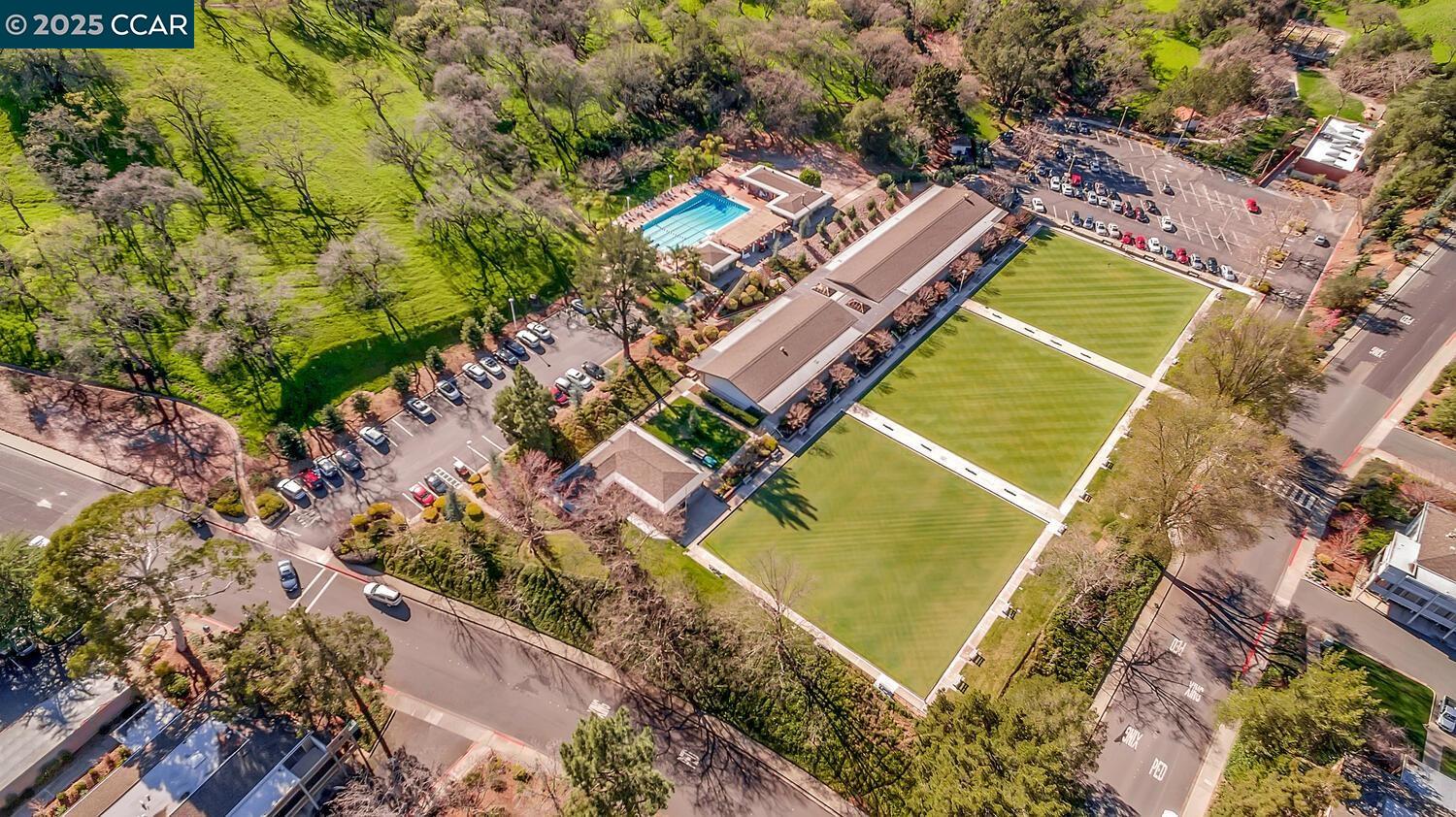 2709 Golden Rain Road, Unit 6 Walnut Creek, CA 94595 - Photo 34 of 46 an aerial view of a tennis ground and a large tree