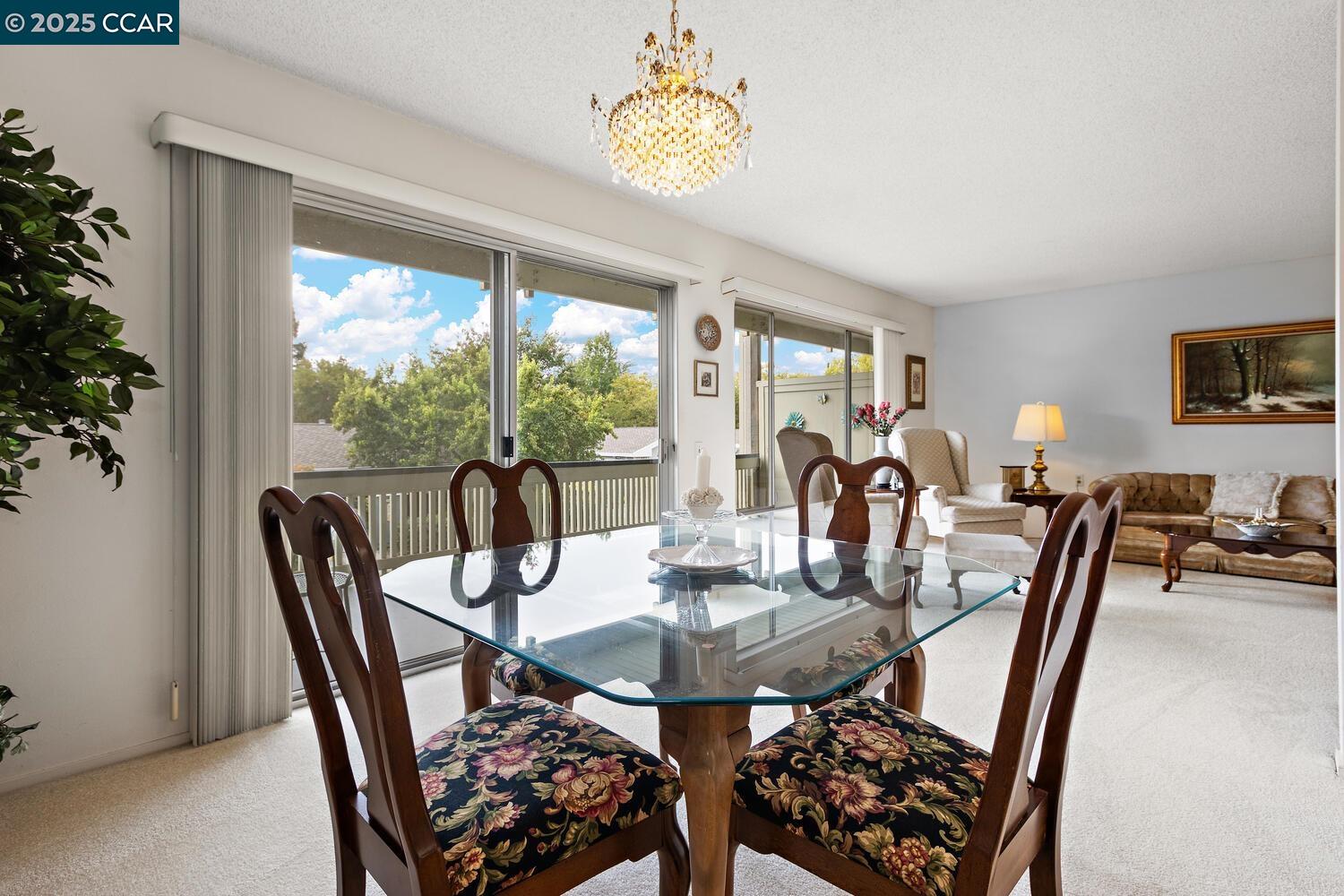2709 Golden Rain Road, Unit 6 Walnut Creek, CA 94595 - Photo 5 of 46 a view of a dining room with furniture window and outside view
