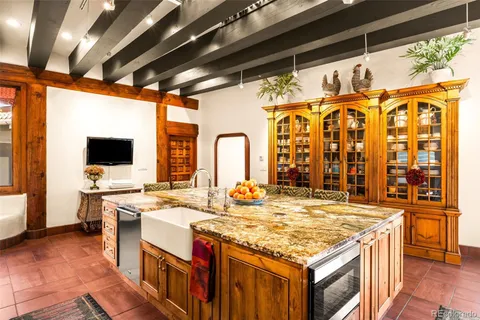 a kitchen with stainless steel appliances granite countertop a sink and cabinets