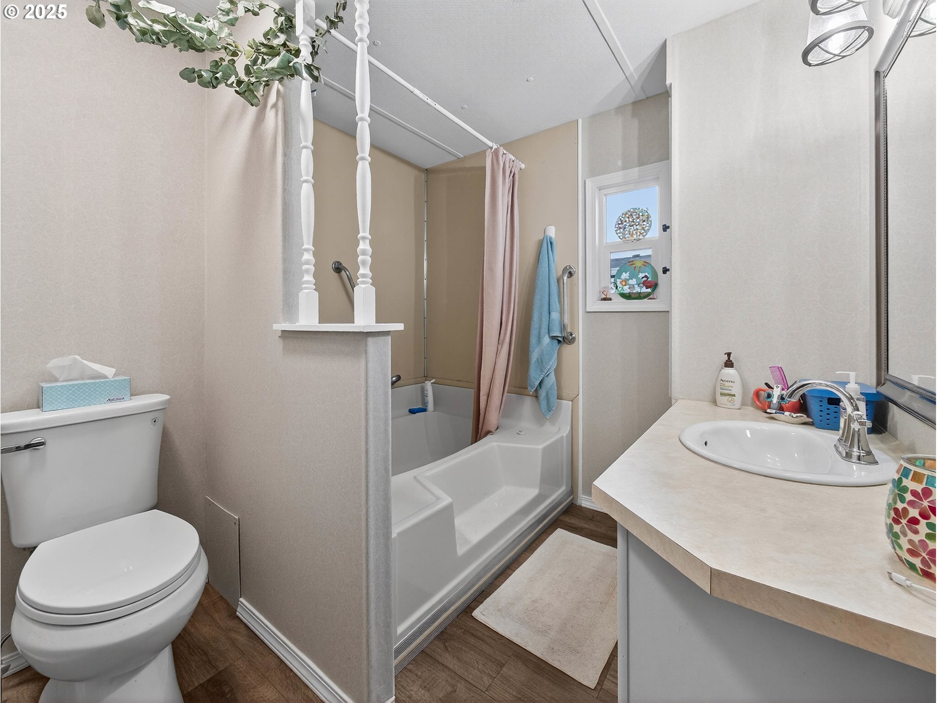 2902 East 2nd Street, Unit 54 Newberg, OR 97132 - Photo 19 of 32 a bathroom with a sink a toilet and shower