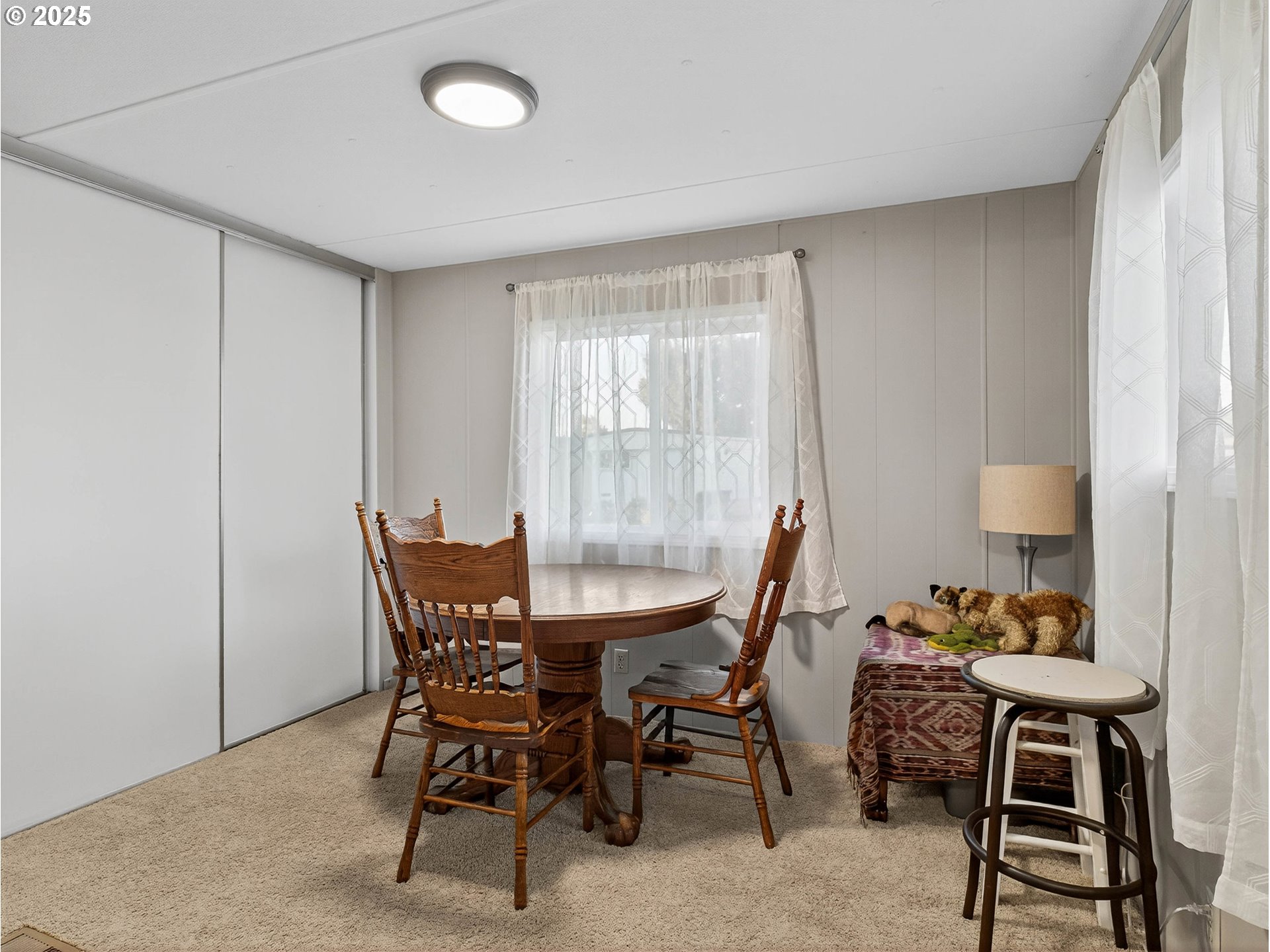 2902 East 2nd Street, Unit 54 Newberg, OR 97132 - Photo 20 of 32 a view of a dining room with furniture and a window