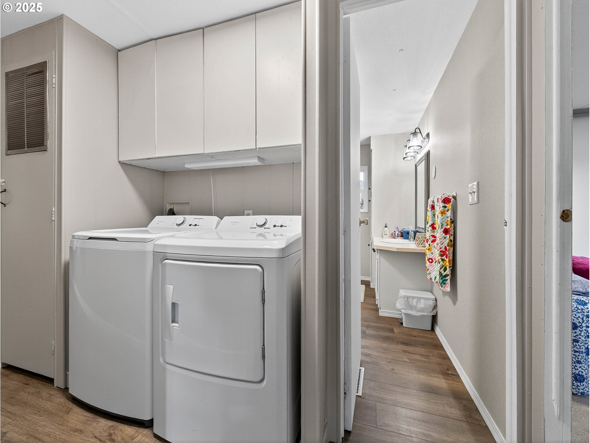 2902 East 2nd Street, Unit 54 Newberg, OR 97132 - Photo 24 of 32 a view of a hallway with washer and dryer