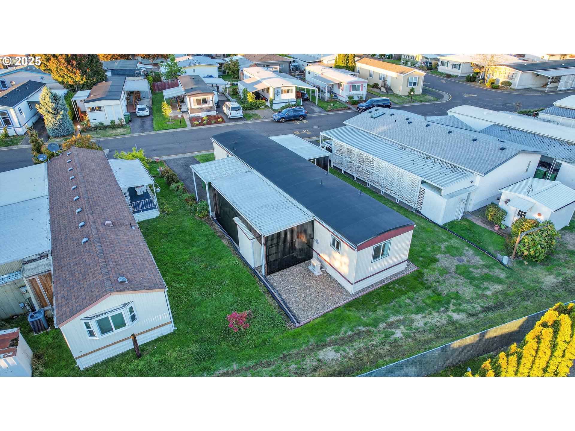 2902 East 2nd Street, Unit 54 Newberg, OR 97132 - Photo 30 of 32 an aerial view of multiple houses with a yard