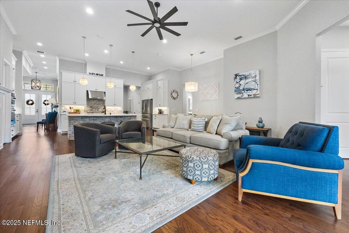 80 Greenview Lane St. Augustine, FL 32092 - Photo 13 of 37 a living room with furniture kitchen view and a wooden floor
