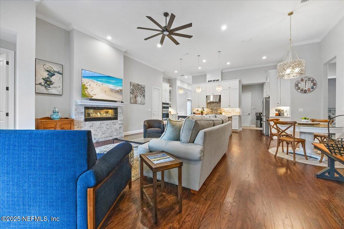 80 Greenview Lane St. Augustine, FL 32092 - Photo 14 of 37 a living room with furniture kitchen view and a chandelier