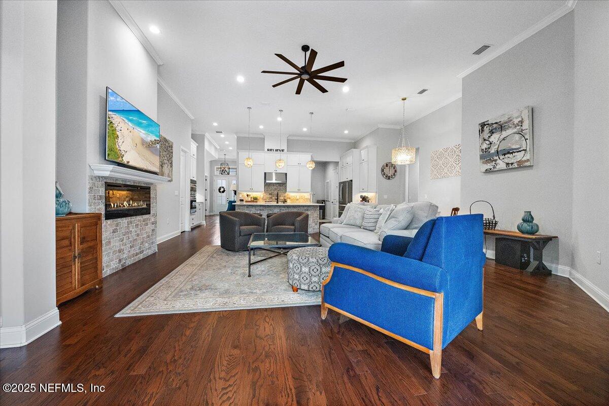80 Greenview Lane St. Augustine, FL 32092 - Photo 21 of 37 a living room with furniture kitchen view and a fireplace