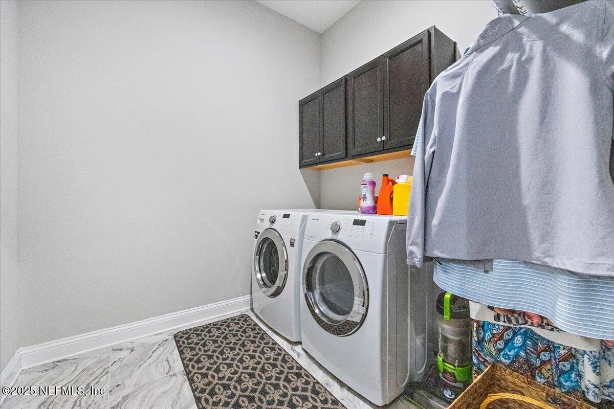 80 Greenview Lane St. Augustine, FL 32092 - Photo 22 of 37 a utility room with dryer and washer