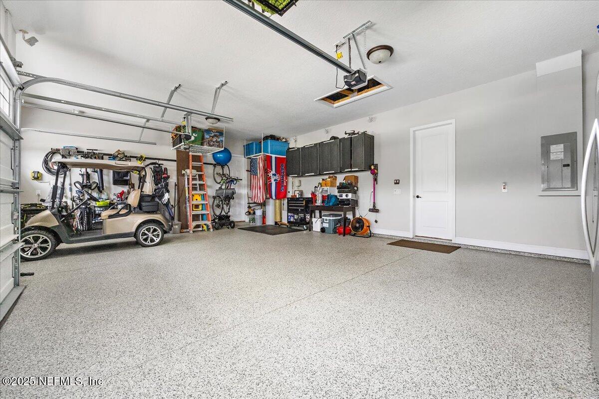 80 Greenview Lane St. Augustine, FL 32092 - Photo 26 of 37 a view of a garage with cars and a garage