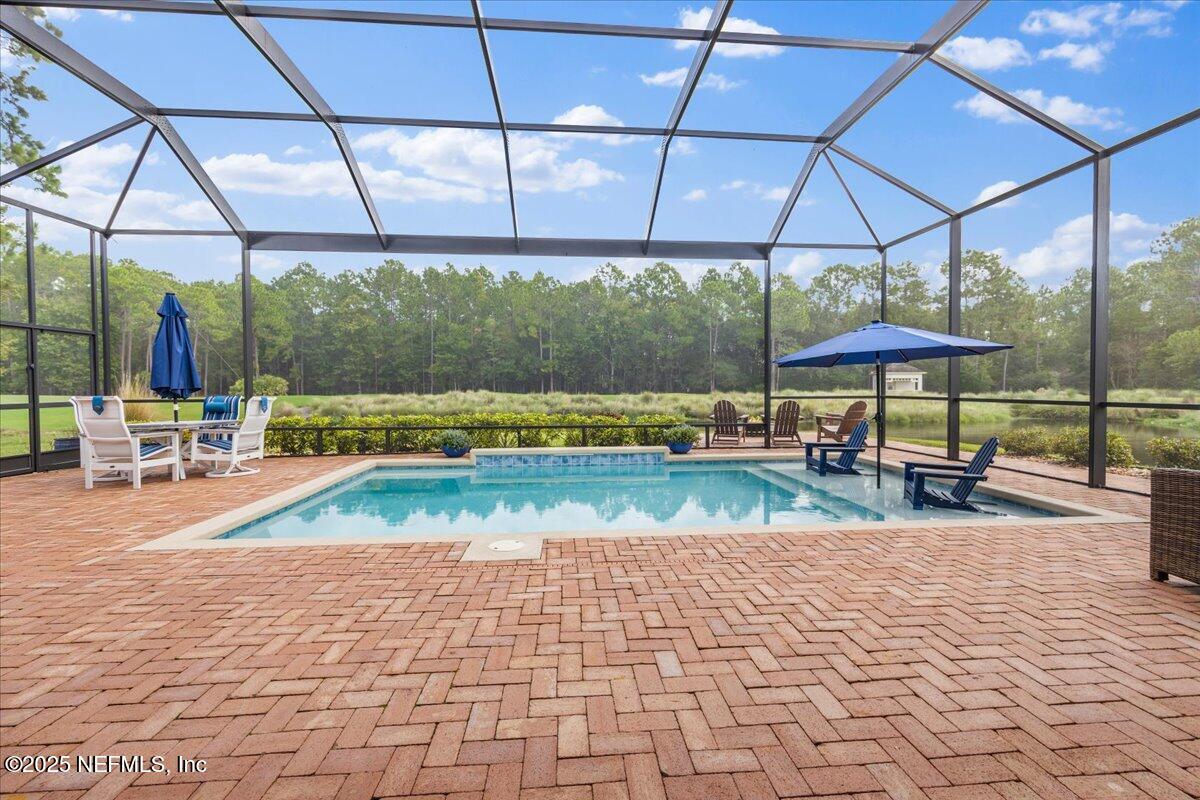 80 Greenview Lane St. Augustine, FL 32092 - Photo 28 of 37 a view of a swimming pool with a patio