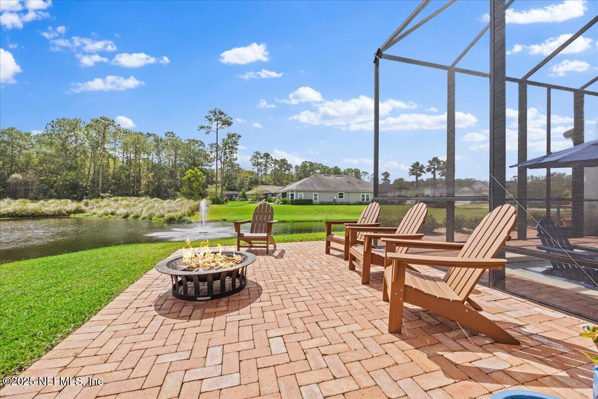 80 Greenview Lane St. Augustine, FL 32092 - Photo 33 of 37 a view of a lake with couches and city view