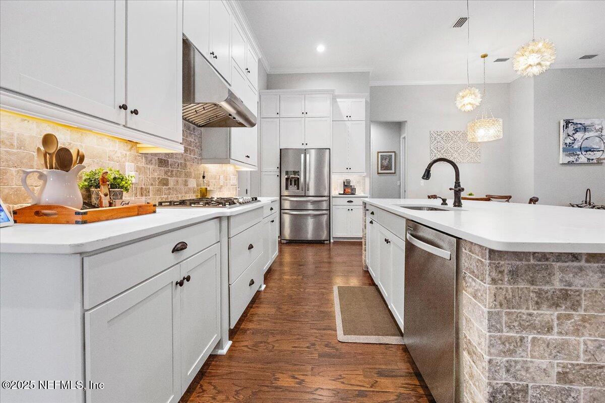 80 Greenview Lane St. Augustine, FL 32092 - Photo 8 of 37 a kitchen with stainless steel appliances granite countertop a sink stove and refrigerator