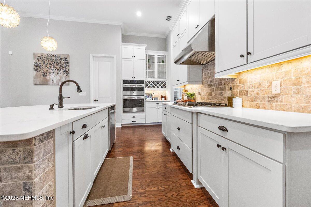 80 Greenview Lane St. Augustine, FL 32092 - Photo 9 of 37 a large white kitchen with stainless steel appliances lots of counter space sink and cabinets