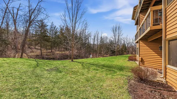 a view of a house with trees in the background