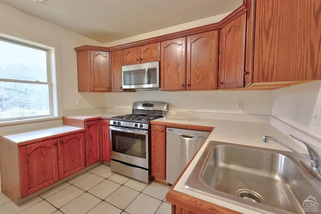 wooden floor in an empty room with stairs